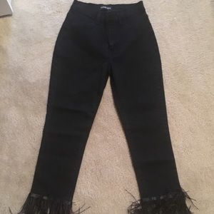 Black jeans with ruffles on the bottom